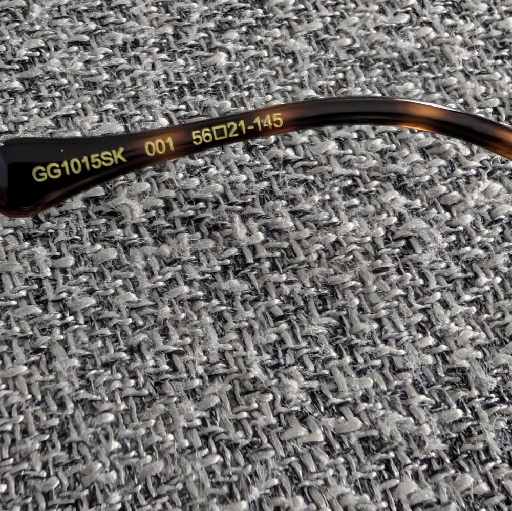 Gucci Women's Sunglasses in Black and Gold